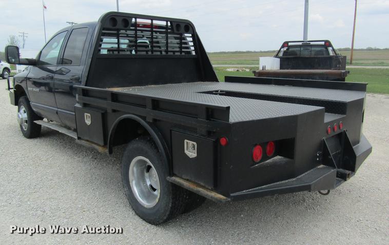 image for item DC4257 2004 Dodge Ram 3500 Quad Cab flatbed pickup truck