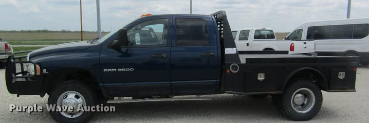 image for item DC4257 2004 Dodge Ram 3500 Quad Cab flatbed pickup truck