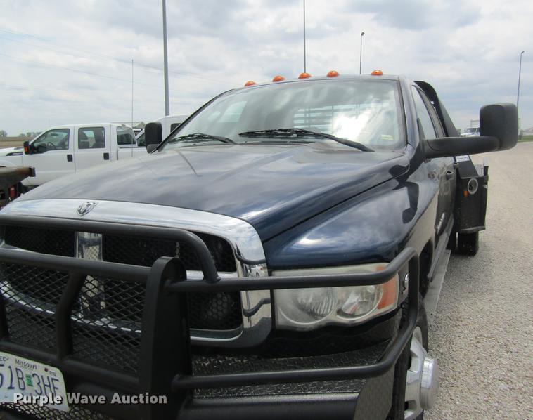 image for item DC4257 2004 Dodge Ram 3500 Quad Cab flatbed pickup truck