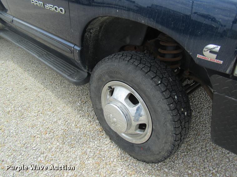 image for item DC4257 2004 Dodge Ram 3500 Quad Cab flatbed pickup truck