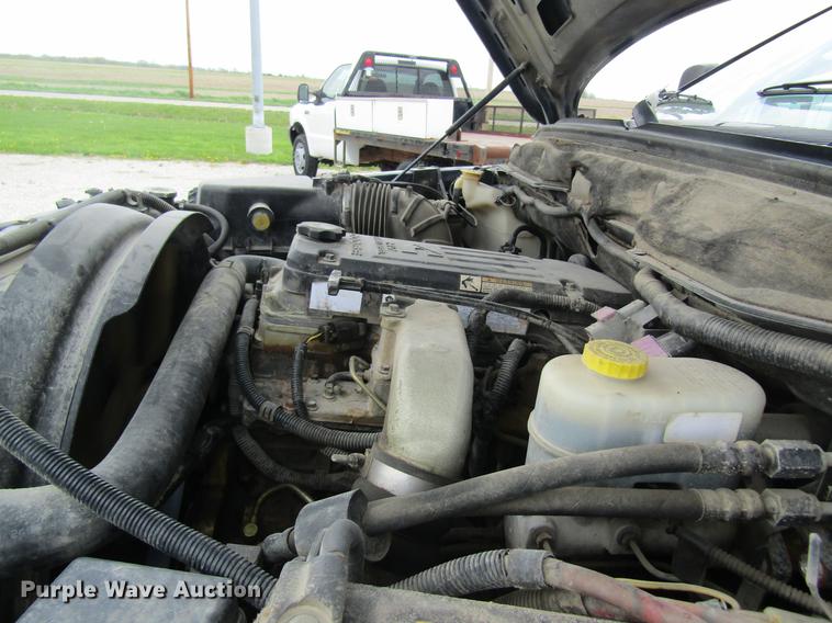 image for item DC4257 2004 Dodge Ram 3500 Quad Cab flatbed pickup truck