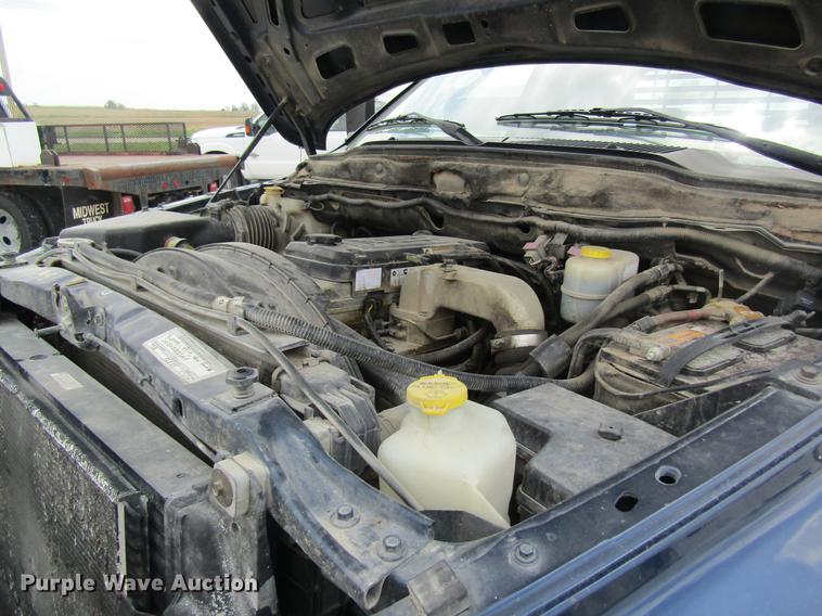 image for item DC4257 2004 Dodge Ram 3500 Quad Cab flatbed pickup truck