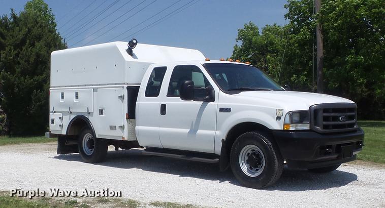 image for item DC7299 2002 Ford F350 Super Duty XL SuperCab utility bed pickup truck