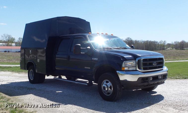 image for item DC7324 2004 Ford F350 Super Duty Lariat Crew Cab utility bed pickup truck