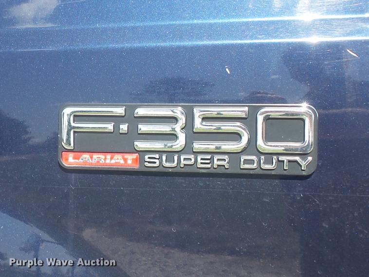 image for item DC7324 2004 Ford F350 Super Duty Lariat Crew Cab utility bed pickup truck