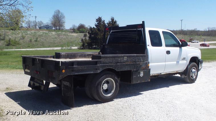 image for item DC7326 2005 Chevrolet Silverado 3500 Ext. Cab flatbed pickup truck