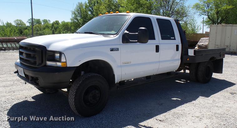 image for item CC9169 2003 Ford F350 Super Duty XL Crew Cab flatbed pickup truck