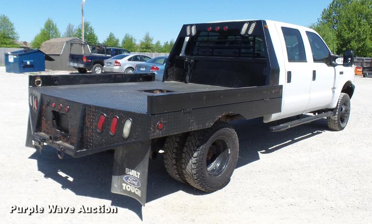 image for item CC9169 2003 Ford F350 Super Duty XL Crew Cab flatbed pickup truck
