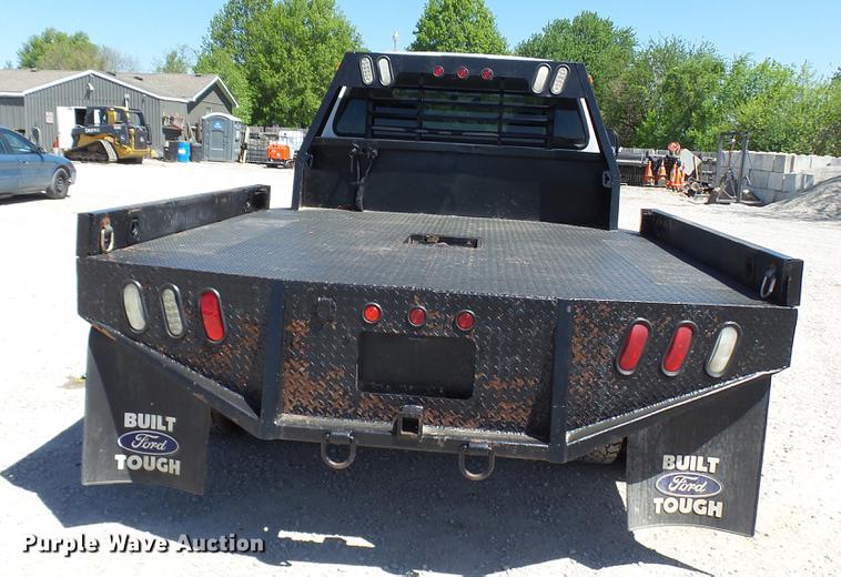 image for item CC9169 2003 Ford F350 Super Duty XL Crew Cab flatbed pickup truck