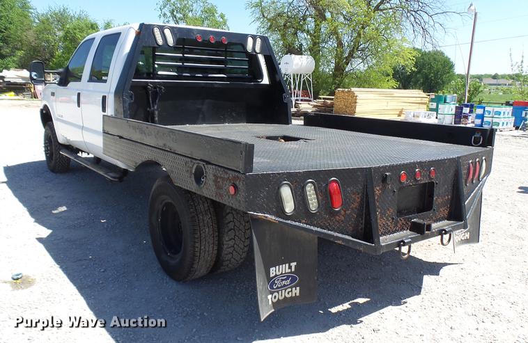image for item CC9169 2003 Ford F350 Super Duty XL Crew Cab flatbed pickup truck