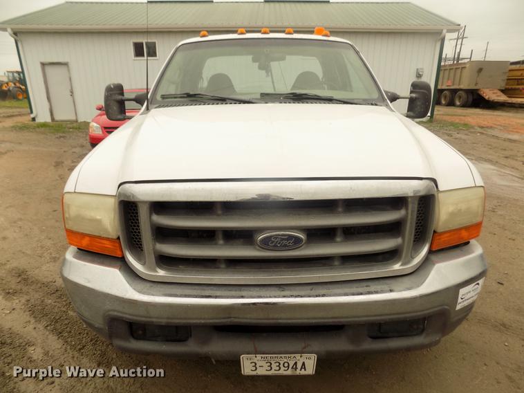 image for item DD2770 1999 Ford F350 Super Duty XLT SuperCab flatbed pickup truck