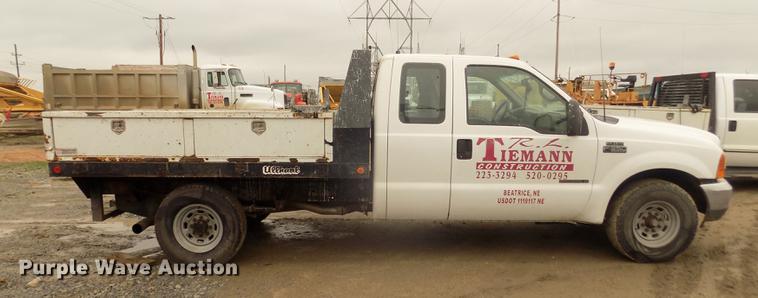 image for item DD2770 1999 Ford F350 Super Duty XLT SuperCab flatbed pickup truck