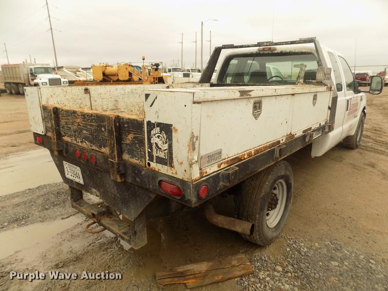 image for item DD2770 1999 Ford F350 Super Duty XLT SuperCab flatbed pickup truck