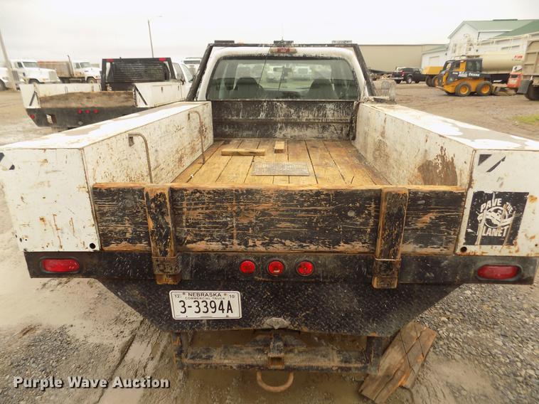 image for item DD2770 1999 Ford F350 Super Duty XLT SuperCab flatbed pickup truck