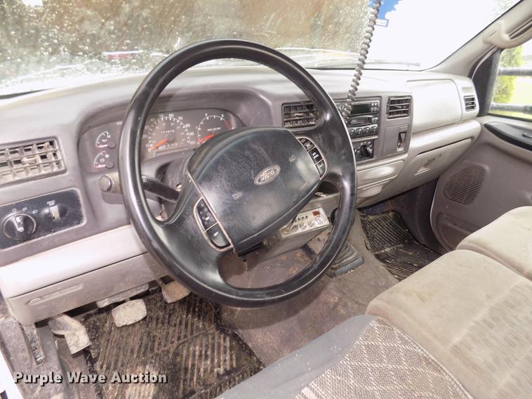 image for item DD2770 1999 Ford F350 Super Duty XLT SuperCab flatbed pickup truck