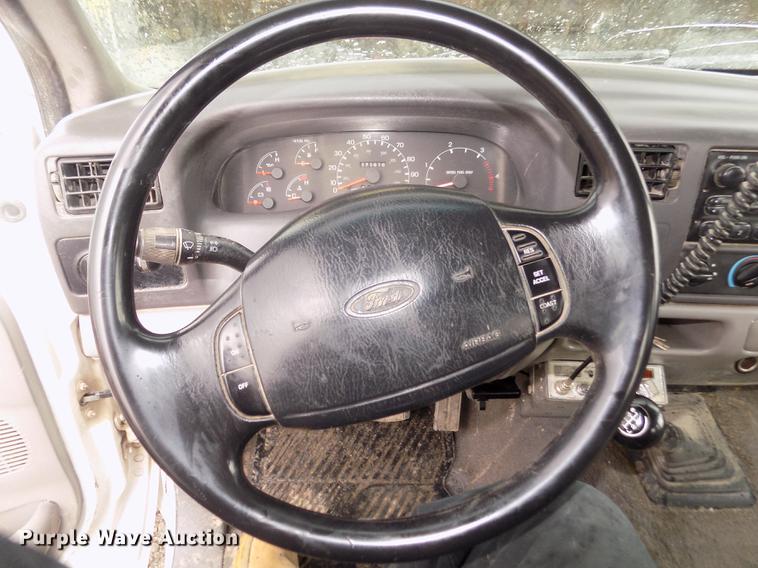 image for item DD2770 1999 Ford F350 Super Duty XLT SuperCab flatbed pickup truck