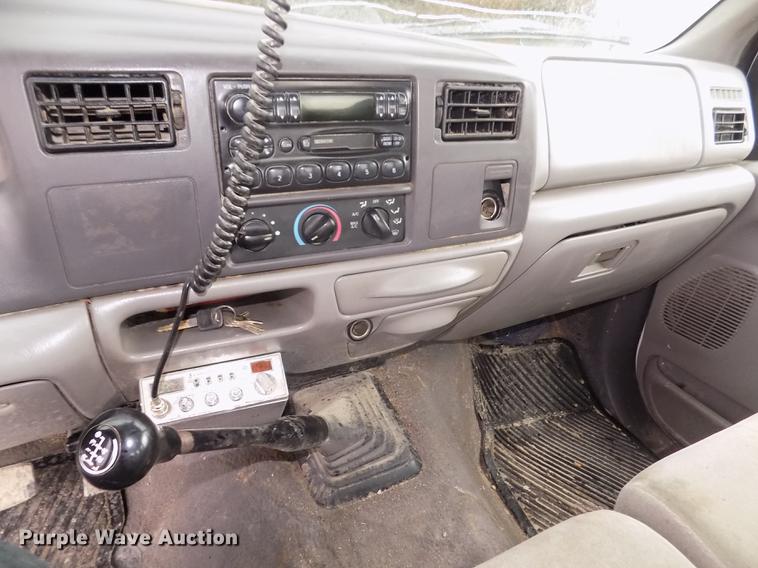 image for item DD2770 1999 Ford F350 Super Duty XLT SuperCab flatbed pickup truck