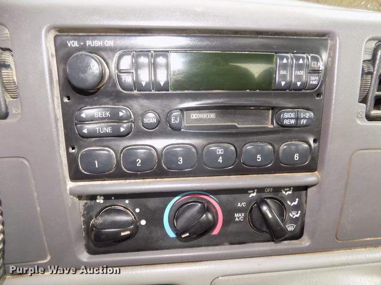 image for item DD2770 1999 Ford F350 Super Duty XLT SuperCab flatbed pickup truck