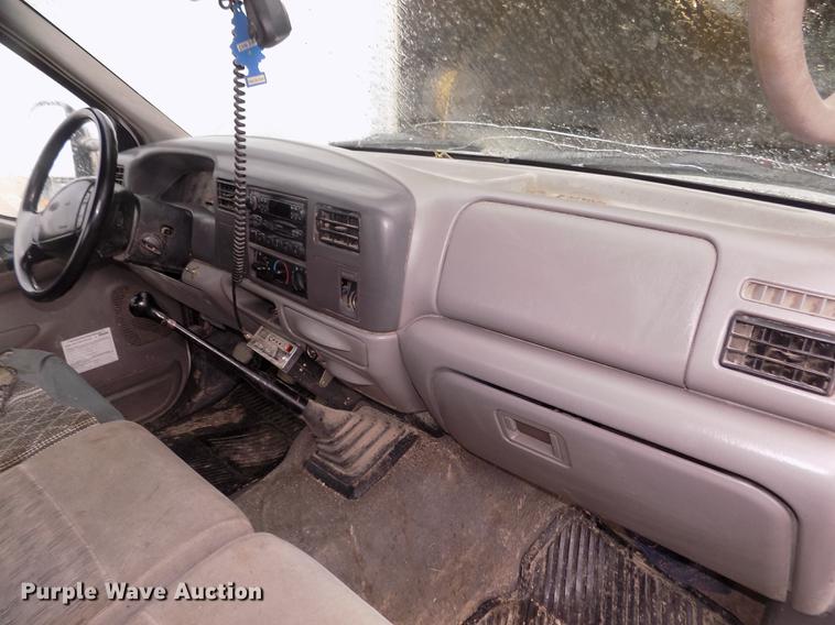 image for item DD2770 1999 Ford F350 Super Duty XLT SuperCab flatbed pickup truck