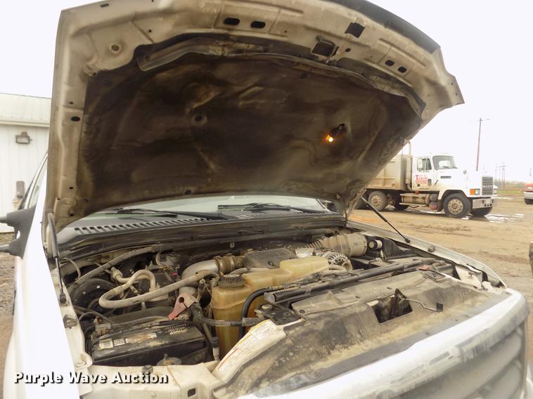 image for item DD2770 1999 Ford F350 Super Duty XLT SuperCab flatbed pickup truck