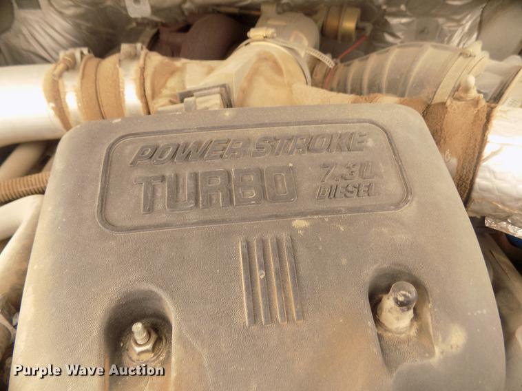 image for item DD2770 1999 Ford F350 Super Duty XLT SuperCab flatbed pickup truck