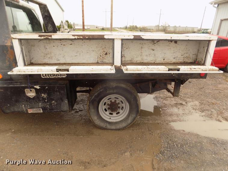 image for item DD2770 1999 Ford F350 Super Duty XLT SuperCab flatbed pickup truck