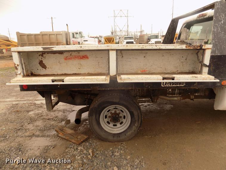 image for item DD2770 1999 Ford F350 Super Duty XLT SuperCab flatbed pickup truck