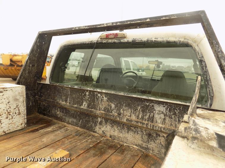 image for item DD2770 1999 Ford F350 Super Duty XLT SuperCab flatbed pickup truck
