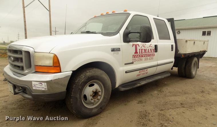 image for item DD2771 2000 Ford F350 Super Duty XLT Crew Cab flatbed pickup truck