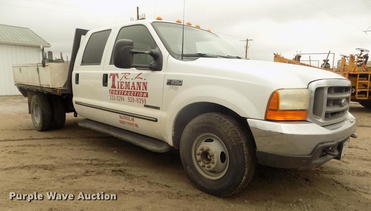 image for item DD2771 2000 Ford F350 Super Duty XLT Crew Cab flatbed pickup truck