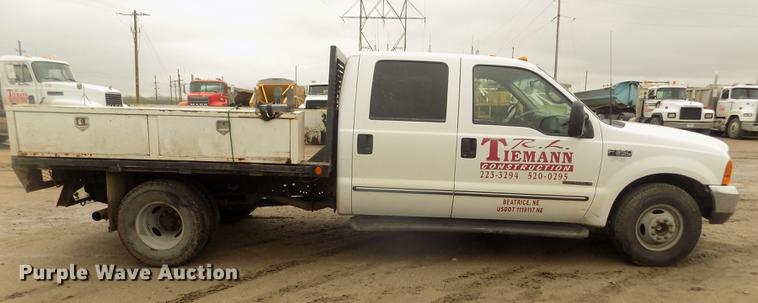 image for item DD2771 2000 Ford F350 Super Duty XLT Crew Cab flatbed pickup truck