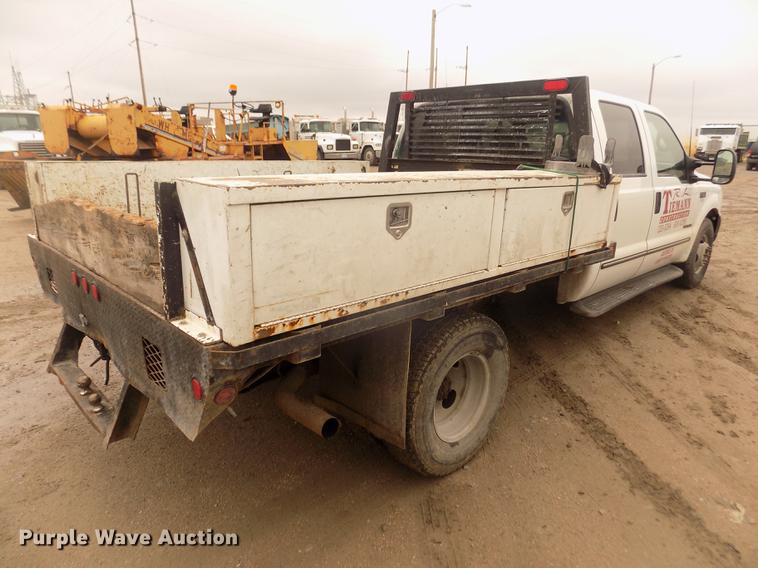 image for item DD2771 2000 Ford F350 Super Duty XLT Crew Cab flatbed pickup truck