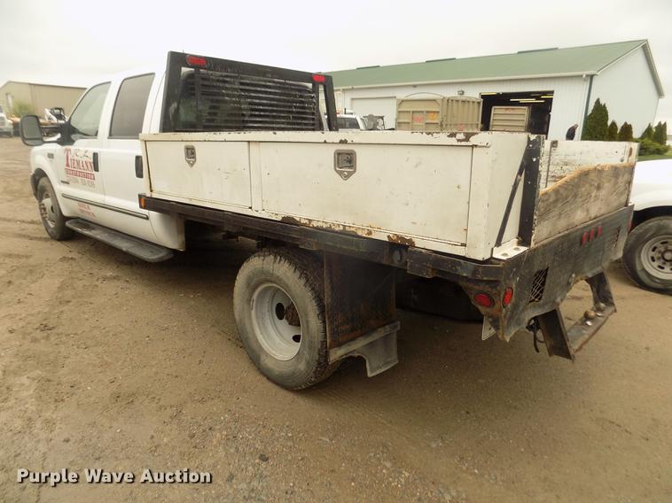 image for item DD2771 2000 Ford F350 Super Duty XLT Crew Cab flatbed pickup truck
