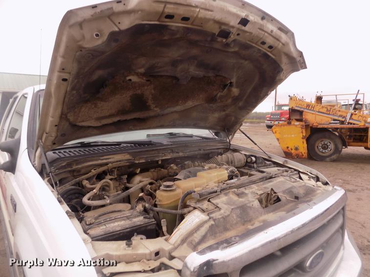 image for item DD2771 2000 Ford F350 Super Duty XLT Crew Cab flatbed pickup truck