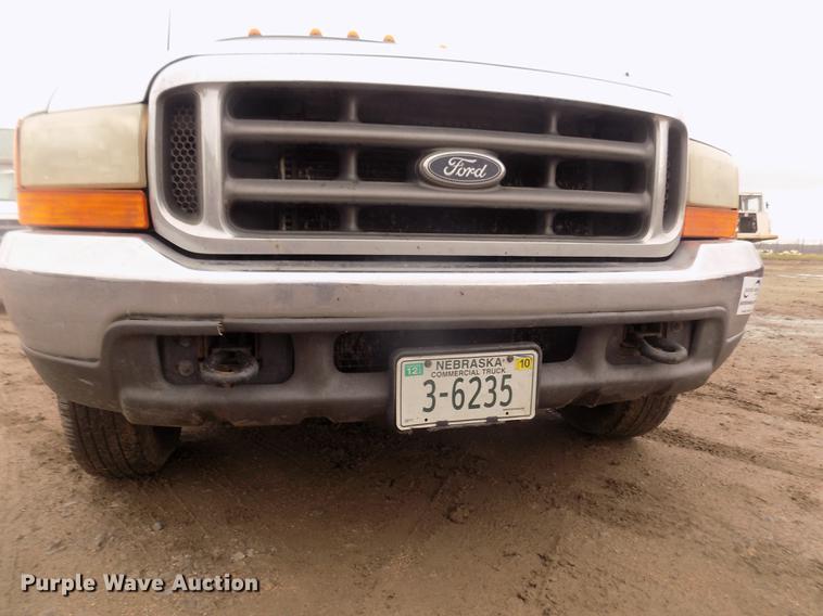 image for item DD2771 2000 Ford F350 Super Duty XLT Crew Cab flatbed pickup truck