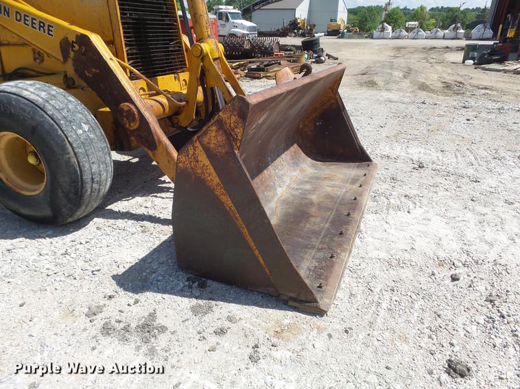 image for item DC7261 1990 John Deere 710C backhoe