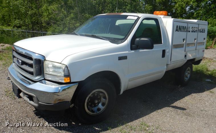 image for item DB6102 2003 Ford F250 Super Duty XLT utility bed pickup truck