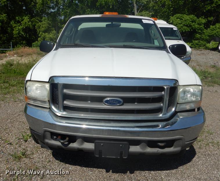 image for item DB6102 2003 Ford F250 Super Duty XLT utility bed pickup truck