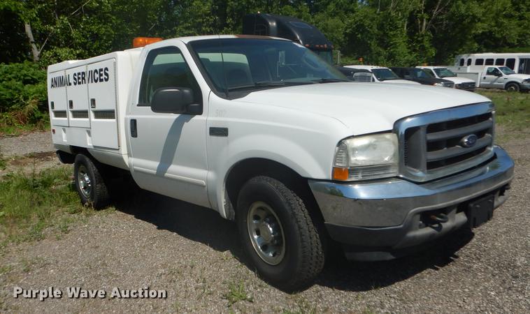 image for item DB6102 2003 Ford F250 Super Duty XLT utility bed pickup truck