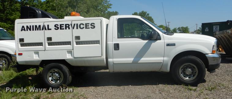 image for item DB6102 2003 Ford F250 Super Duty XLT utility bed pickup truck