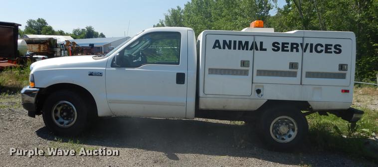 image for item DB6102 2003 Ford F250 Super Duty XLT utility bed pickup truck