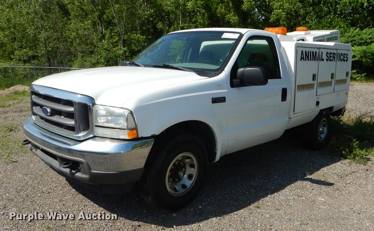 image for item DB6103 2004 Ford F250 Super Duty XLT utility bed pickup truck