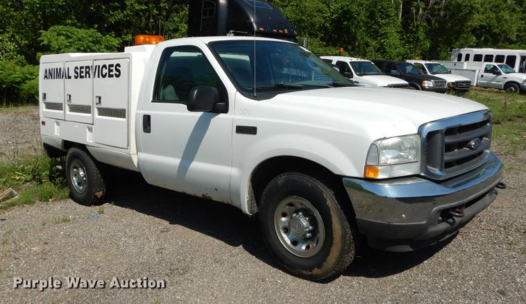 image for item DB6103 2004 Ford F250 Super Duty XLT utility bed pickup truck