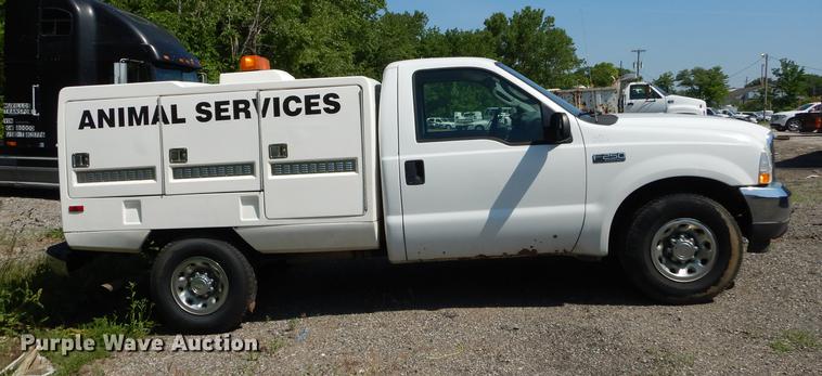 image for item DB6103 2004 Ford F250 Super Duty XLT utility bed pickup truck