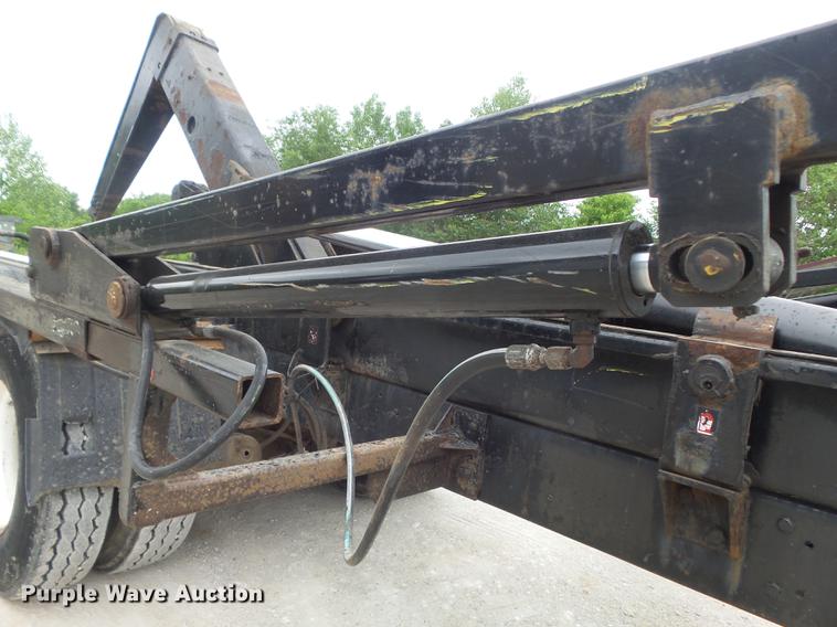 image for item DC7269 1999 Mack DM690S hooklift truck