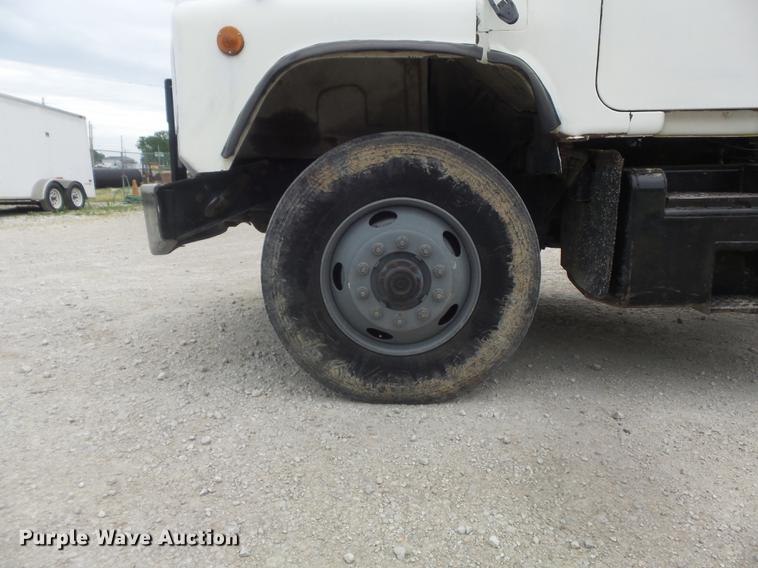 image for item DC7269 1999 Mack DM690S hooklift truck