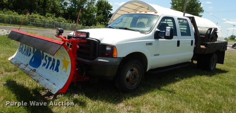 image for item DE1753 2005 Ford F350 Super Duty Crew Cab dump flatbed pickup truck