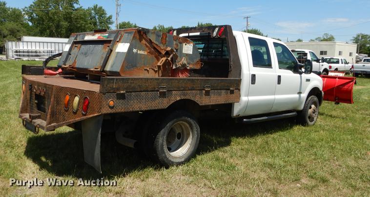 image for item DE1753 2005 Ford F350 Super Duty Crew Cab dump flatbed pickup truck