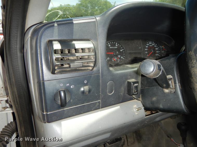 image for item DE1753 2005 Ford F350 Super Duty Crew Cab dump flatbed pickup truck