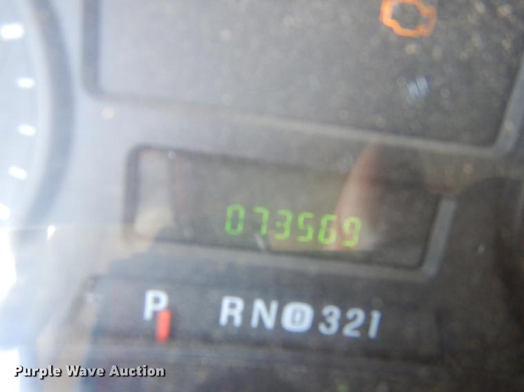 image for item DE1753 2005 Ford F350 Super Duty Crew Cab dump flatbed pickup truck